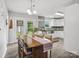 Dining area with white wainscoting and french doors, leading to the outdoor space at 1758 Bridlewood Ct, Gastonia, NC 28054