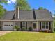 Charming single-story home with landscaped front yard, and black window shutters at 1758 Bridlewood Ct, Gastonia, NC 28054