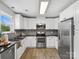 Modern kitchen featuring stainless steel appliances, white cabinets, and granite countertops at 1758 Bridlewood Ct, Gastonia, NC 28054