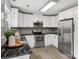 Modern kitchen featuring granite countertops, stainless steel appliances, and updated lighting at 1758 Bridlewood Ct, Gastonia, NC 28054
