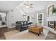 Comfortable living room with fireplace, vaulted ceiling, and view of the staircase at 1758 Bridlewood Ct, Gastonia, NC 28054