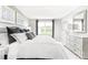 Inviting bedroom features a plush bed, bedside tables, and a dresser with bright natural lighting at 2067 Stephens Farm Dr # C, China Grove, NC 28023