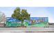 Colorful 'Welcome To Hickory' mural with airplane and text against a blue sky at 2067 Stephens Farm Dr # C, China Grove, NC 28023
