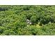 Aerial view showing the property's serene setting among lush trees and natural landscape at 208 Devonport Dr # 25, Weddington, NC 28104
