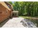 Backyard with a brick patio and outdoor seating, perfect for relaxing and entertaining at 208 Devonport Dr # 25, Weddington, NC 28104