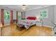 Bright bedroom with hardwood floors, ample natural light, and classic decor offers a peaceful retreat at 208 Devonport Dr # 25, Weddington, NC 28104