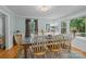 Bright dining room featuring hardwood floors, wainscoting, and a large bay window at 208 Devonport Dr # 25, Weddington, NC 28104