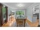 Bright dining room featuring hardwood floors, wainscoting, and a large bay window at 208 Devonport Dr # 25, Weddington, NC 28104