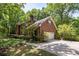 Exterior view of a beautiful brick home showcasing lush landscaping at 208 Devonport Dr # 25, Weddington, NC 28104