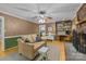 Inviting living room features a brick fireplace, comfortable seating, and views into the kitchen, perfect for relaxation at 208 Devonport Dr # 25, Weddington, NC 28104