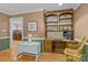 Charming home office boasts built-in shelving, wooden desk, and traditional decor, perfect for a productive workspace at 208 Devonport Dr # 25, Weddington, NC 28104