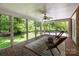 A screened porch featuring comfortable seating and picturesque views of the backyard at 208 Devonport Dr # 25, Weddington, NC 28104