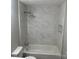 Clean bathroom featuring a tiled shower with modern fixtures and a crisp white toilet at 209 Brookview Rd, Statesville, NC 28625