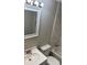 Stylish bathroom featuring tiled walls, modern fixtures, and a clean white vanity with a mirror at 209 Brookview Rd, Statesville, NC 28625