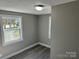 Small bedroom featuring neutral tones and bright natural light from a window at 209 Brookview Rd, Statesville, NC 28625