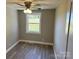 Small bedroom featuring neutral tones, a ceiling fan, and bright natural light from a window at 209 Brookview Rd, Statesville, NC 28625