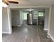 Kitchen features new gray cabinets, stainless steel refrigerator, and modern flooring at 209 Brookview Rd, Statesville, NC 28625