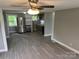 Kitchen features new gray cabinets, stainless steel refrigerator, and modern flooring at 209 Brookview Rd, Statesville, NC 28625