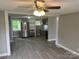 Kitchen features new gray cabinets, stainless steel refrigerator, and modern flooring at 209 Brookview Rd, Statesville, NC 28625
