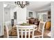Inviting dining area leads to a cozy living room and efficient kitchen layout at 21136 Cold Spring Ln, Cornelius, NC 28031