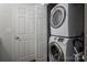 Convenient laundry area with stacked washer and dryer, plus additional storage space at 21136 Cold Spring Ln, Cornelius, NC 28031