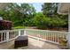 Relaxing back patio with wooded views, a cozy seating area, and room for entertaining at 21136 Cold Spring Ln, Cornelius, NC 28031