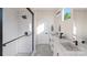 Bright bathroom featuring a walk-in shower, double vanity, and modern fixtures at 233 Cherokee Rose Ln # 31, Charlotte, NC 28217
