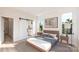 Cozy bedroom boasts natural light, and a sliding barn door leading to the bathroom at 233 Cherokee Rose Ln # 31, Charlotte, NC 28217
