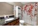 Functional bathroom design with granite vanity, medicine cabinet, and a decorative floral shower curtain at 246 Mallard Head Dr, Rock Hill, SC 29732