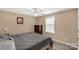 Cozy bedroom featuring a comfortable bed, neutral walls, ceiling fan, and a bright window at 246 Mallard Head Dr, Rock Hill, SC 29732