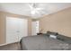 Comfortable bedroom showcasing carpeted floors, ceiling fan, double door closet and great natural light at 246 Mallard Head Dr, Rock Hill, SC 29732