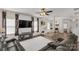 Inviting living room with a sectional sofa, and view to the dining area with hardwood flooring throughout at 246 Mallard Head Dr, Rock Hill, SC 29732