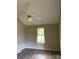 Bedroom with hardwood floors, neutral walls, a window view, and modern ceiling fan at 2473 Greenwood Rd, Rock Hill, SC 29730