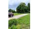 Long driveway leading to the home surrounded by lush green landscaping at 2473 Greenwood Rd, Rock Hill, SC 29730