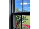Up-close shot of the window with red flowers outside at 2473 Greenwood Rd, Rock Hill, SC 29730