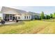 A sprawling lawn and patio furniture highlight the backyard, perfect for relaxation and entertaining at 3001 Henshaw Rd, Waxhaw, NC 28173