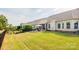 Expansive backyard with lush lawn, a patio, and a black metal fence at 3001 Henshaw Rd, Waxhaw, NC 28173