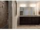 Lovely bathroom featuring a granite countertop, undermount sinks, tile floors, and a glass enclosed shower at 3001 Henshaw Rd, Waxhaw, NC 28173