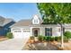 Inviting home with a two-car garage, neat landscaping, and a welcoming entrance at 3001 Henshaw Rd, Waxhaw, NC 28173