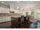 Well-appointed kitchen with granite countertops and a breakfast bar seating area at 3001 Henshaw Rd, Waxhaw, NC 28173