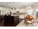 Modern kitchen featuring stainless steel appliances, granite counters, and breakfast area at 3001 Henshaw Rd, Waxhaw, NC 28173