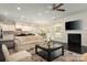 Bright living room open to the kitchen featuring a fireplace and neutral decor at 3001 Henshaw Rd, Waxhaw, NC 28173