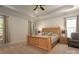 Serene main bedroom with neutral colors, tray ceiling and ample natural light at 3001 Henshaw Rd, Waxhaw, NC 28173