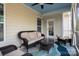Comfortable screened-in porch with wicker furniture and views of the backyard at 3001 Henshaw Rd, Waxhaw, NC 28173