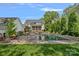 Backyard oasis with a sparkling pool, lounge area, and manicured landscaping at 309 Catawba Ave, Davidson, NC 28036