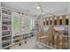 Bedroom featuring bunk bed, a hanging hammock chair, and a window with custom shelving at 309 Catawba Ave, Davidson, NC 28036
