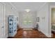 Elegant foyer featuring hardwood floors, a decorative cabinet, and French doors at 309 Catawba Ave, Davidson, NC 28036