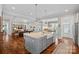 Spacious kitchen with stainless steel appliances, granite countertops, and seamless flow into the living and dining areas at 309 Catawba Ave, Davidson, NC 28036