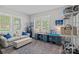 Inviting living room with hardwood floors, large windows and custom blue cabinetry at 309 Catawba Ave, Davidson, NC 28036
