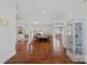 Open-concept living space with hardwood floors, built-in shelving, fireplace, and plenty of natural light at 309 Catawba Ave, Davidson, NC 28036